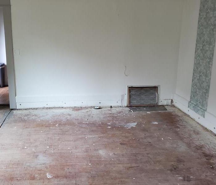 Dining Room with Buckled Hardwood Floors Removed