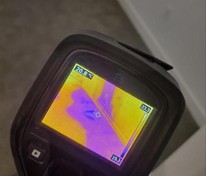 Thermal camera showing water on floor and in walls