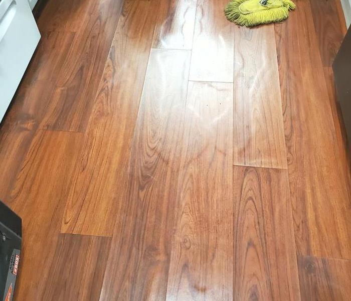 Vinyl plank flooring with visual water damage